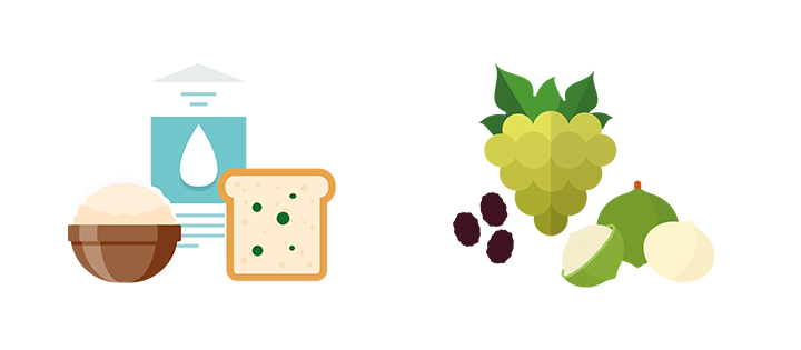 A loaf of uncooked bread together with a milk bottle and a green grape